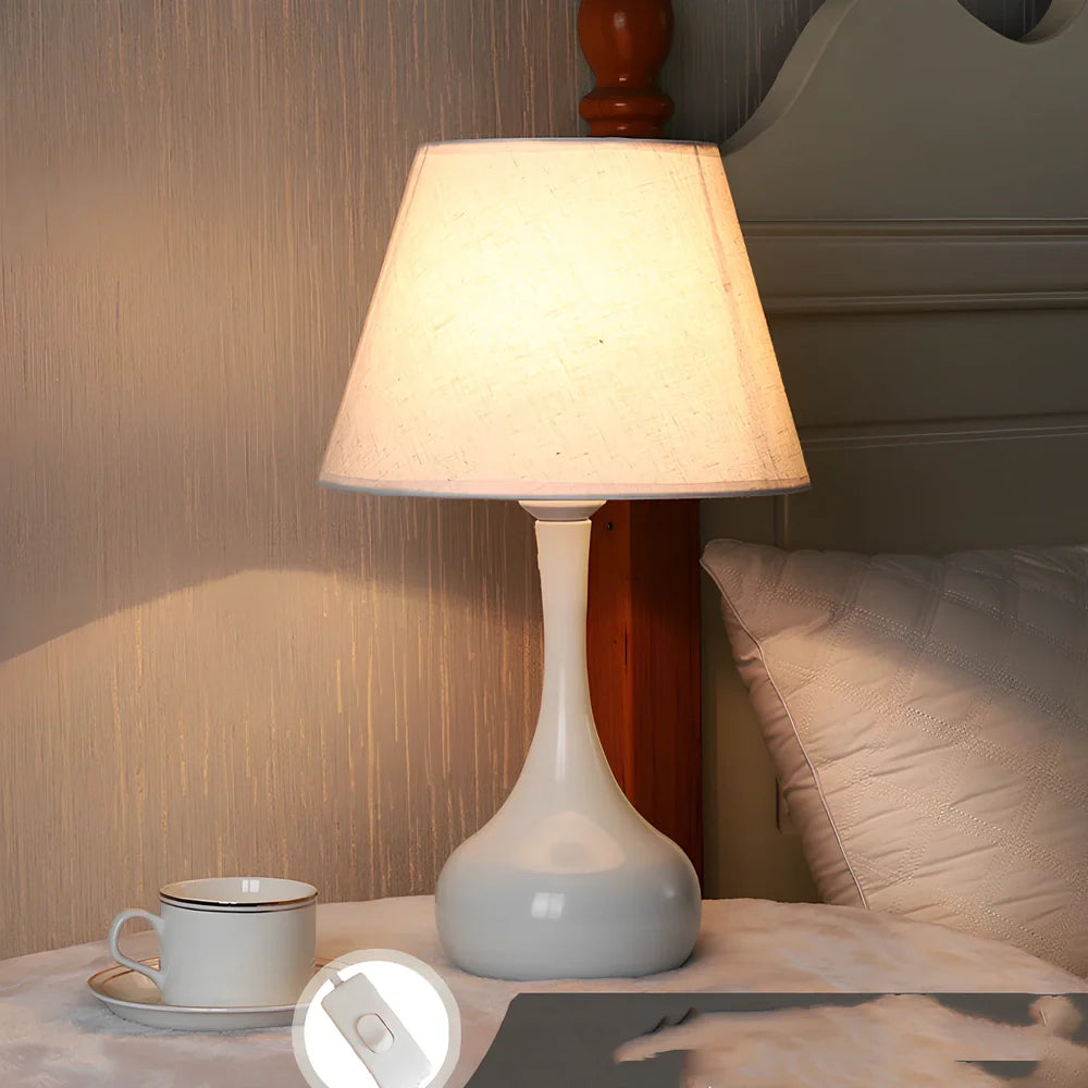 Feather table lamp with hand-woven fur shade and iron base showing adjustable lighting controls