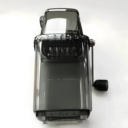 Manual ice crusher with transparent housing showing stainless steel blades and 2L capacity markings