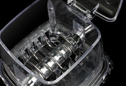 Manual ice crusher with transparent housing showing stainless steel blades and 2L capacity markings