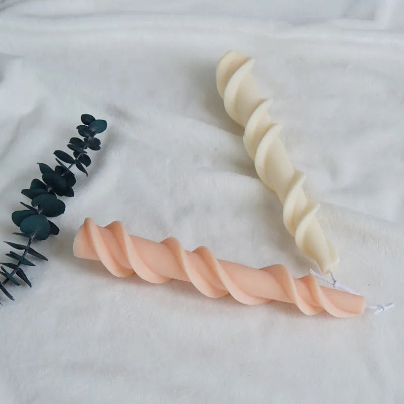 Close-up of a spiral lace rod silicone candle mould in photo colour for making textured pillar candles.