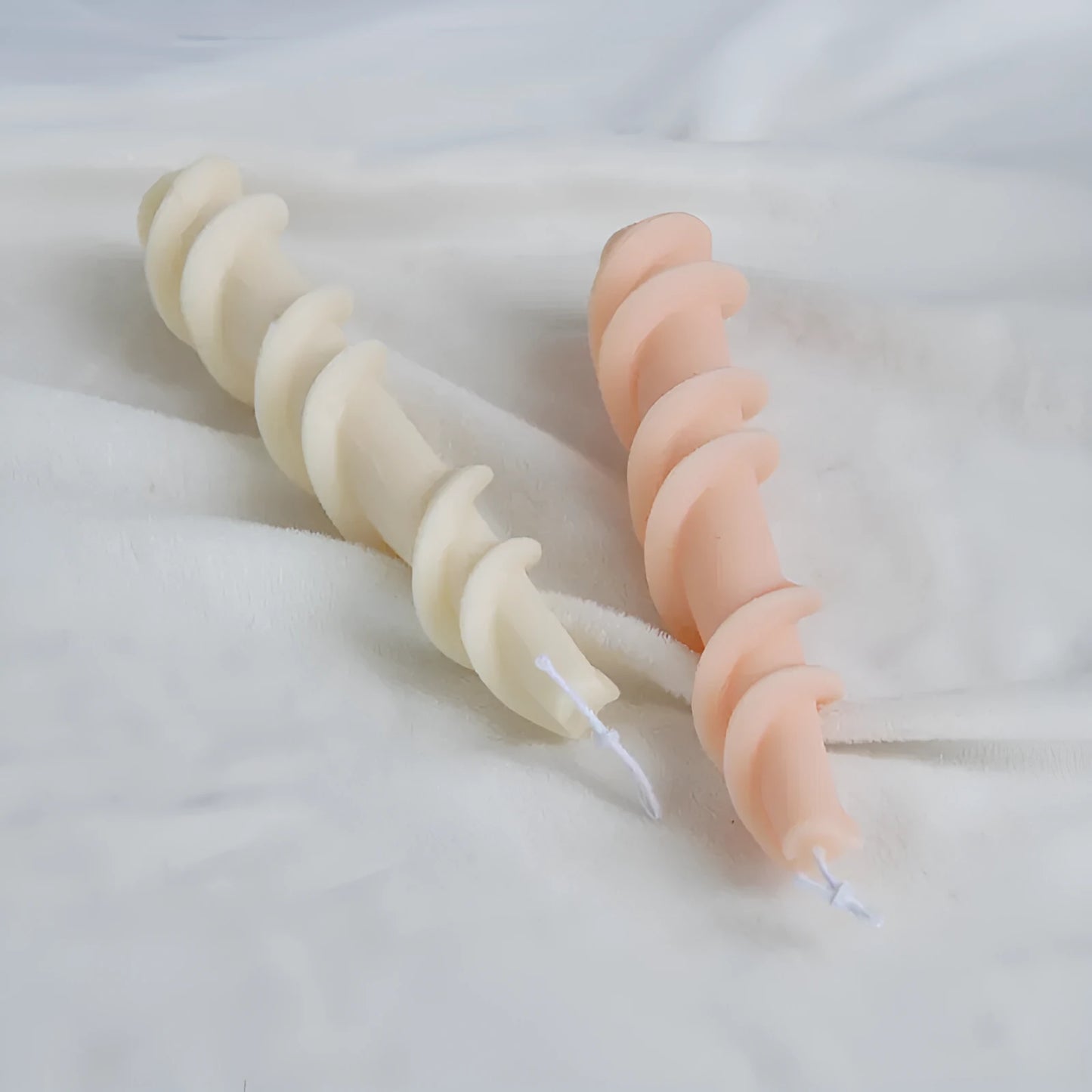Close-up of a spiral lace rod silicone candle mould in photo colour for making textured pillar candles.