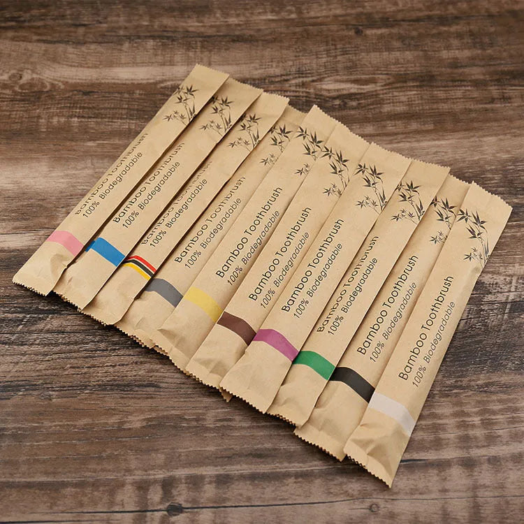 10 natural bamboo toothbrushes with charcoal bristles in six colours showing 17.5cm length