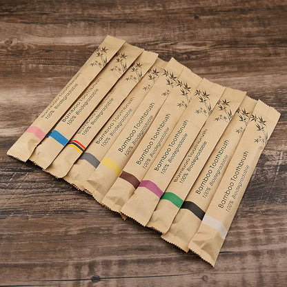 10 natural bamboo toothbrushes with charcoal bristles in six colours showing 17.5cm length
