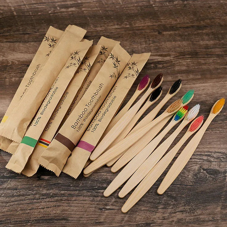 10 natural bamboo toothbrushes with charcoal bristles in six colours showing 17.5cm length