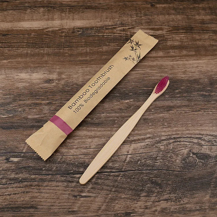 10 natural bamboo toothbrushes with charcoal bristles in six colours showing 17.5cm length
