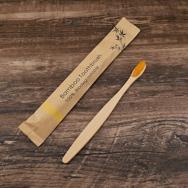10 natural bamboo toothbrushes with charcoal bristles in six colours showing 17.5cm length