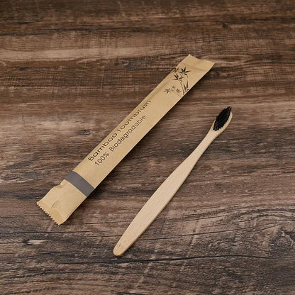 10 natural bamboo toothbrushes with charcoal bristles in six colours showing 17.5cm length