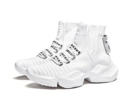 Men's black and white casual sports shoes with mesh lining, shown in large sizes.