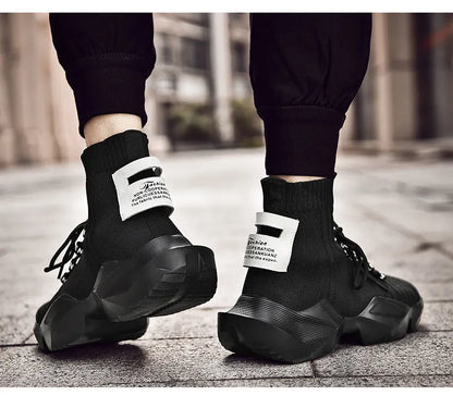 Men's black and white casual sports shoes with mesh lining, shown in large sizes.