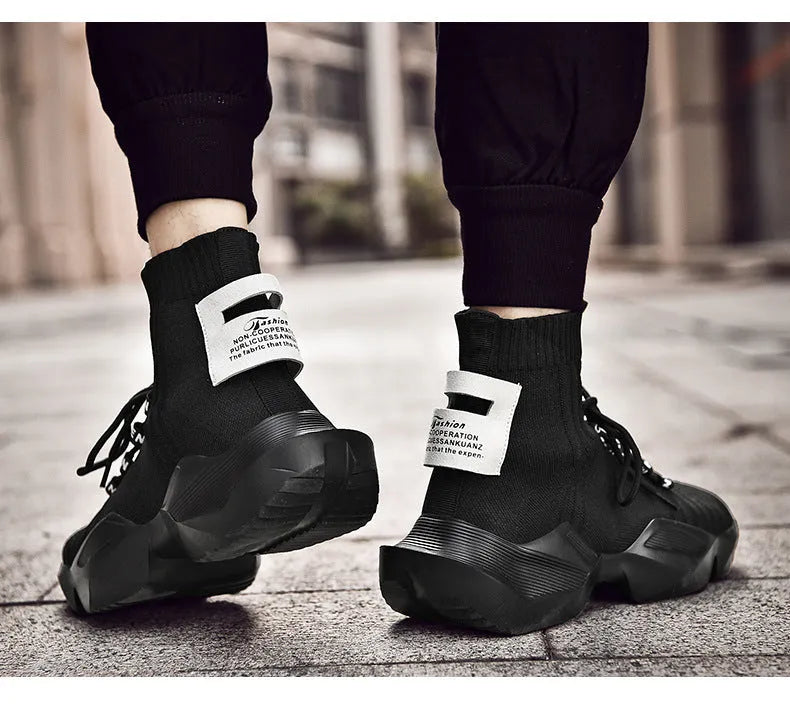 Men's large size casual sports shoes in black or white, available from size 39 to 47. These trainers use adhesive construction and feature a mesh inner lining, designed for everyday wear.