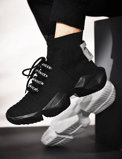 Men's black and white casual sports shoes with mesh lining, shown in large sizes.