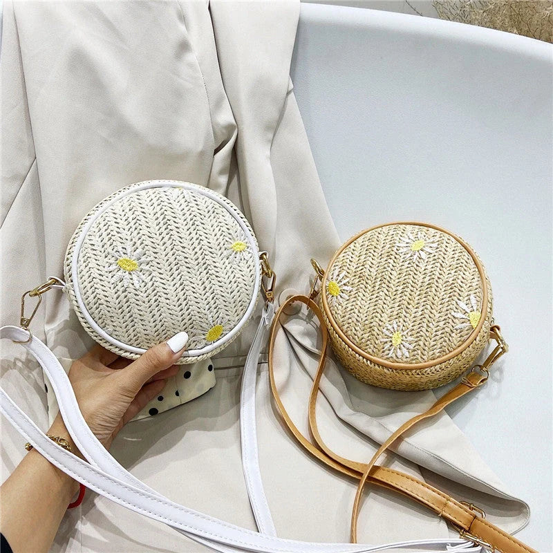 Straw woven small round bag with embroidered detail and smooth zipper