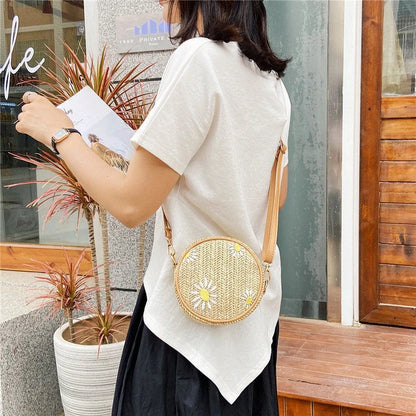 Straw woven small round bag with embroidered detail and smooth zipper