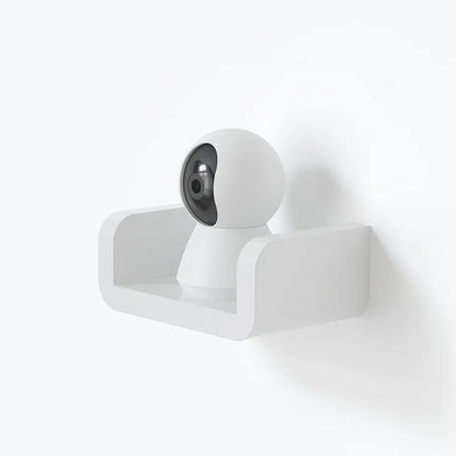White plastic bathroom storage shelf mounted with suction cups on a tiled wall.
