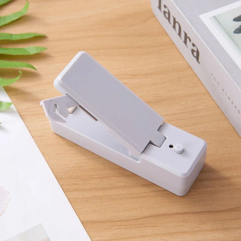 Portable ABS mini snack packaging bag heat sealing machine in white grey