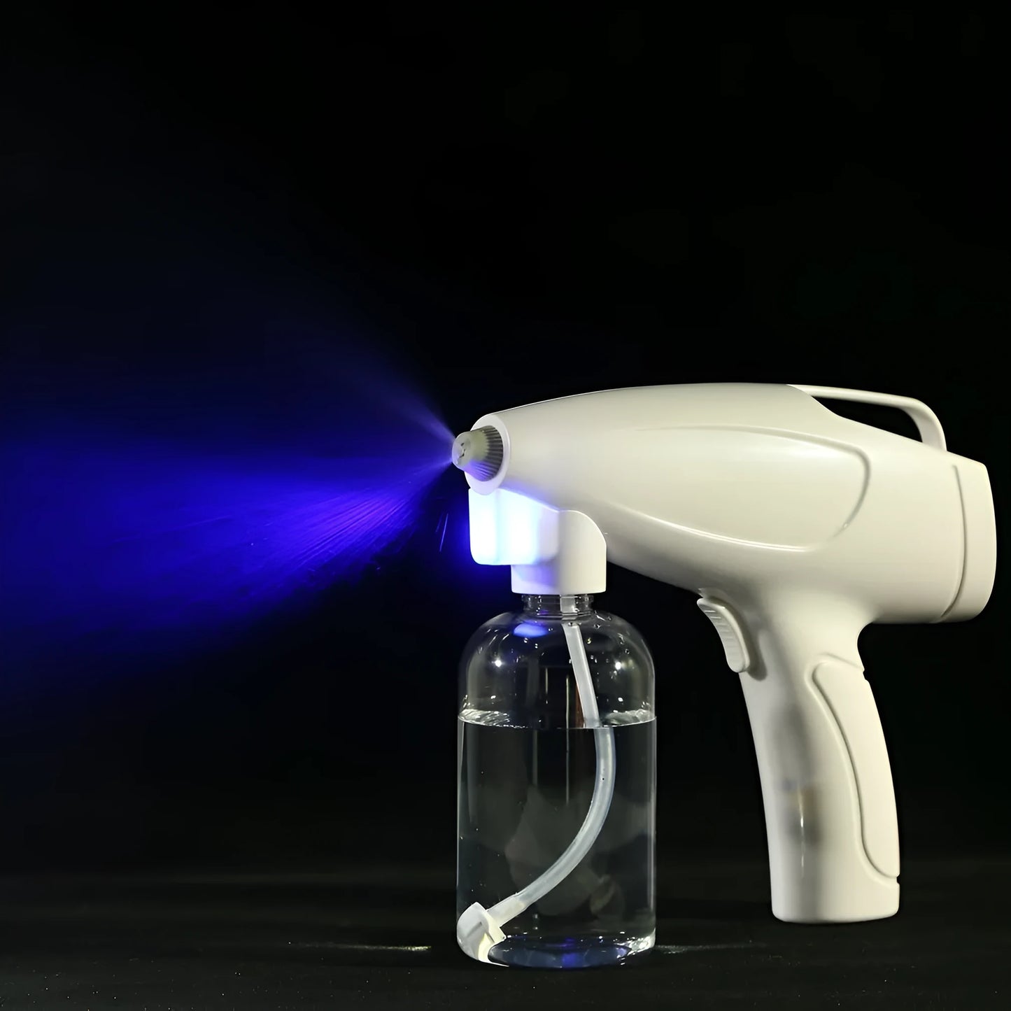 White handheld cordless electric spray disinfection gun with USB-C port and trigger, showing mist spray.