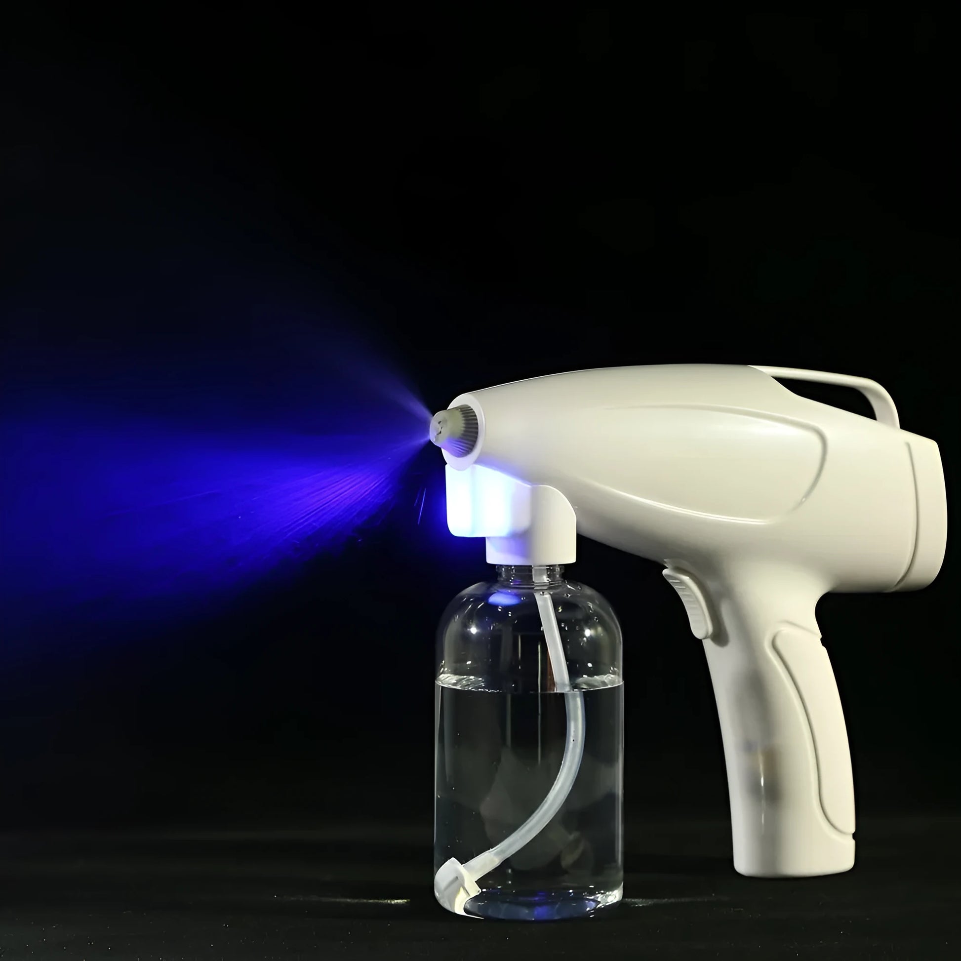 White handheld cordless electric spray disinfection gun with USB-C port and trigger, showing mist spray.