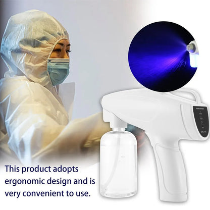 White handheld cordless electric spray disinfection gun with USB-C port and trigger, showing mist spray.