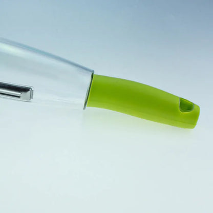 Green vegetable peeler with a transparent storage box attached, showing a stainless steel blade.