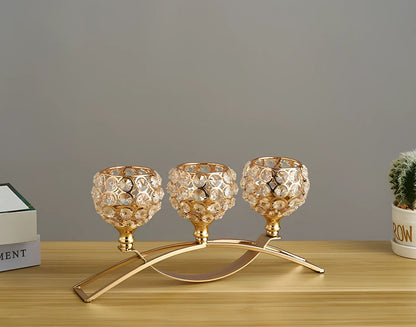 Geometric crystal candle holder with wrought iron frame in gold electroplated finish, 15cm height