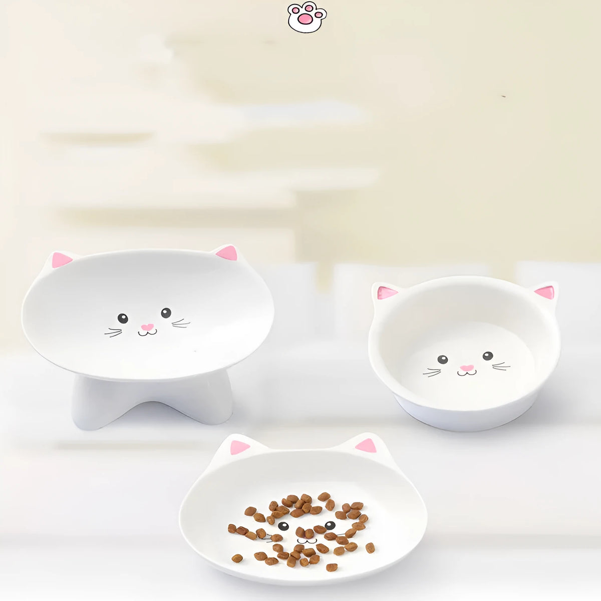 White ceramic pet food bowl with raised cat face design for cats and small dogs