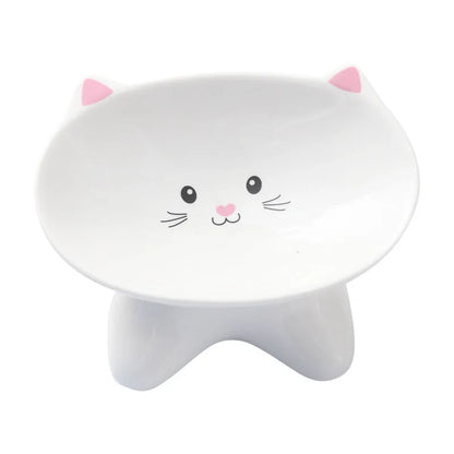 White ceramic pet food bowl with raised cat face design for cats and small dogs
