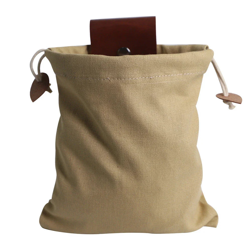 Rugged and versatile waxed canvas hiking waist bag with belt loop for outdoor adventures and berry foraging