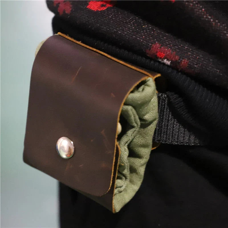 Rugged and versatile waxed canvas hiking waist bag with belt loop for outdoor adventures and berry foraging