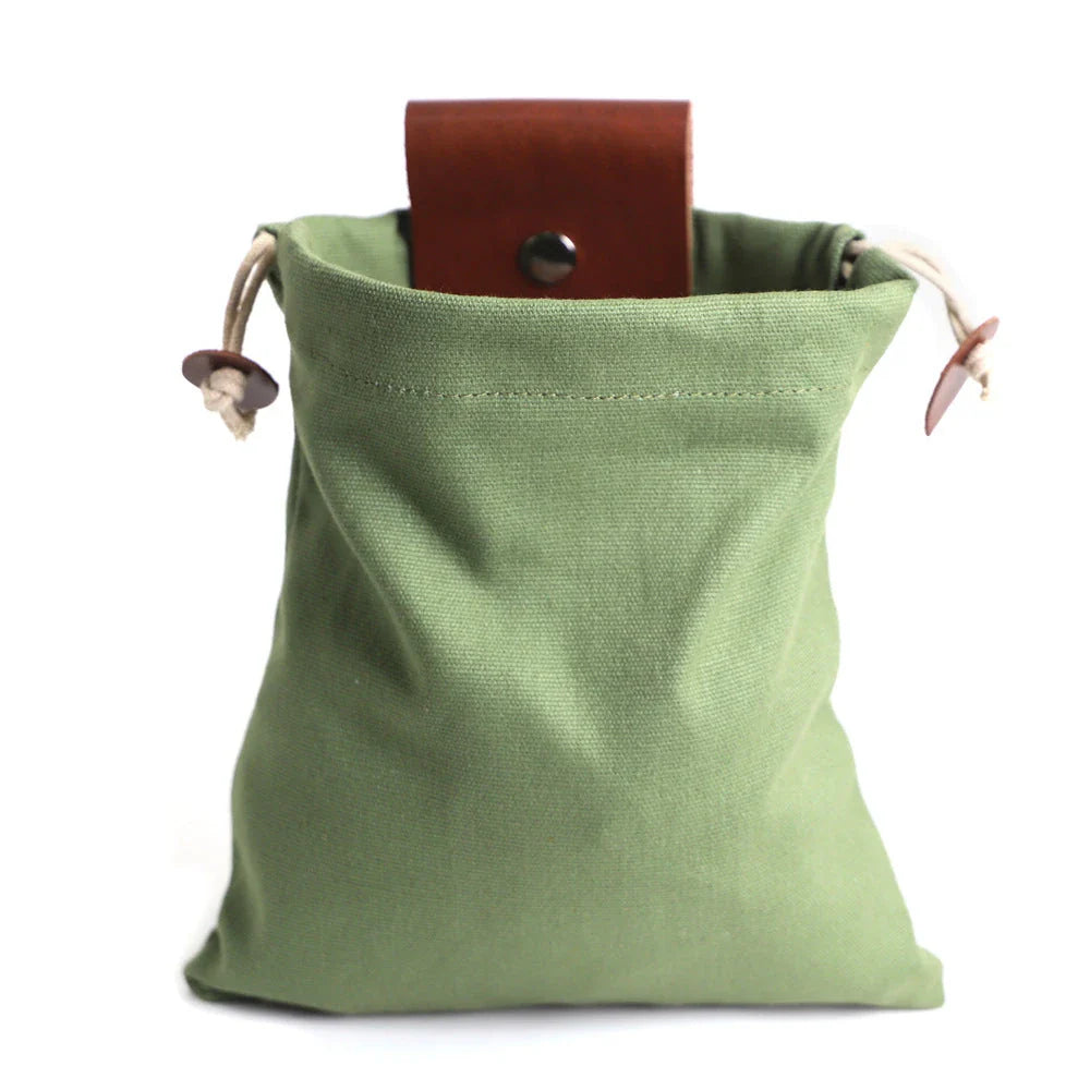 Rugged and versatile waxed canvas hiking waist bag with belt loop for outdoor adventures and berry foraging
