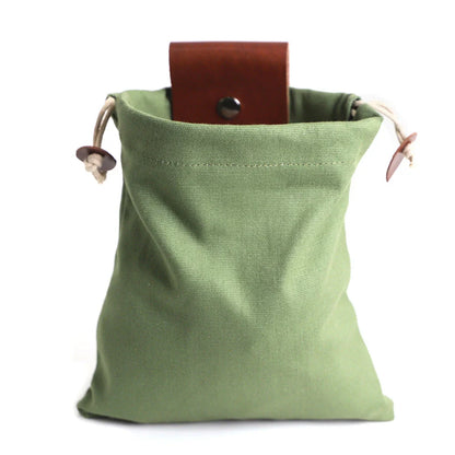 Rugged and versatile waxed canvas hiking waist bag with belt loop for outdoor adventures and berry foraging