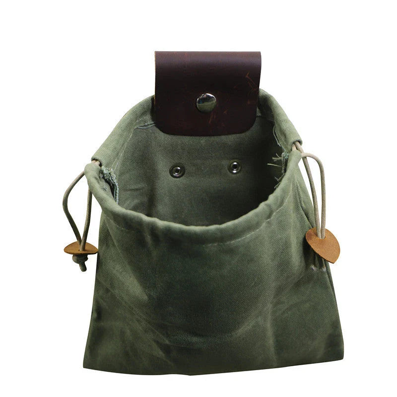 Rugged and versatile waxed canvas hiking waist bag with belt loop for outdoor adventures and berry foraging