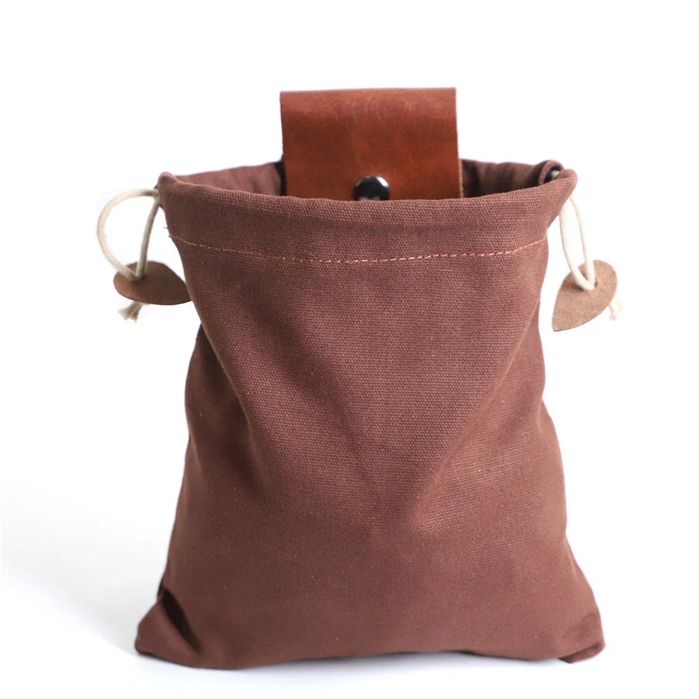Rugged and versatile waxed canvas hiking waist bag with belt loop for outdoor adventures and berry foraging