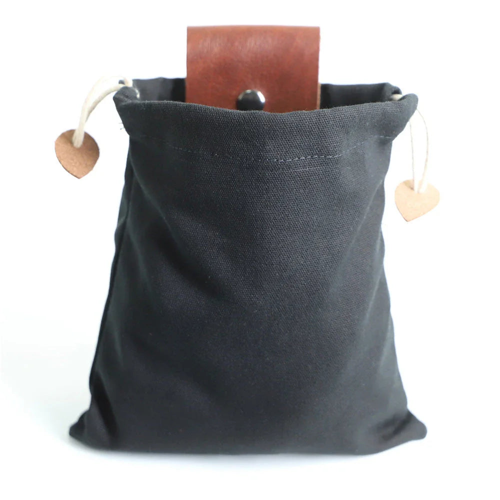 Rugged and versatile waxed canvas hiking waist bag with belt loop for outdoor adventures and berry foraging