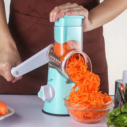 Blue multi-function vegetable chopper with suction cup base on a kitchen countertop.