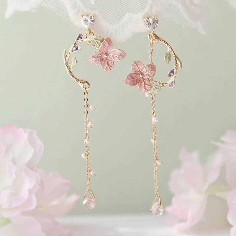 Elegant rose blossom earrings featuring delicate floral designs and tassel accents in a variety of styles