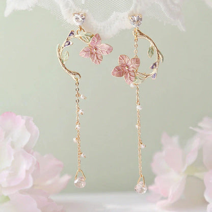 Elegant rose blossom earrings featuring delicate floral designs and tassel accents in a variety of styles