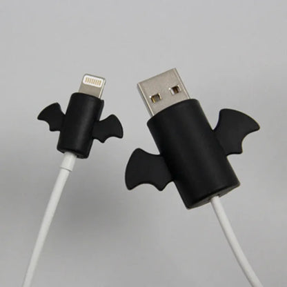 White and black silicone protective covers for mobile phone charging and data cables showing two size options