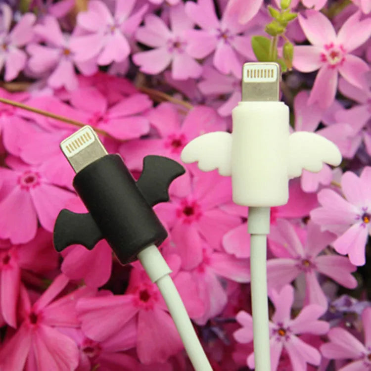 White and black silicone protective covers for mobile phone charging and data cables showing two size options
