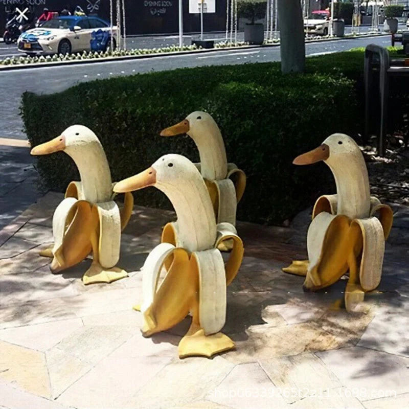Vibrant yellow banana duck resin garden statue for outdoor decoration