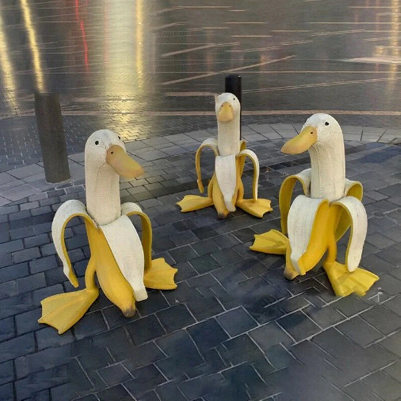 Vibrant yellow banana duck resin garden statue for outdoor decoration