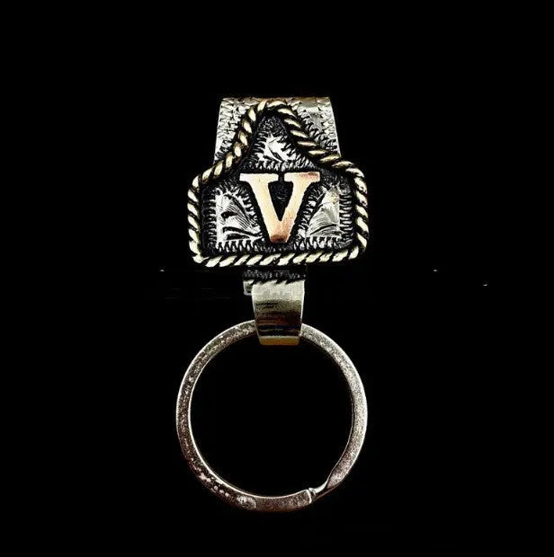 Handmade cow tag design metal keychain on a keyring, shown in one of many available colours.