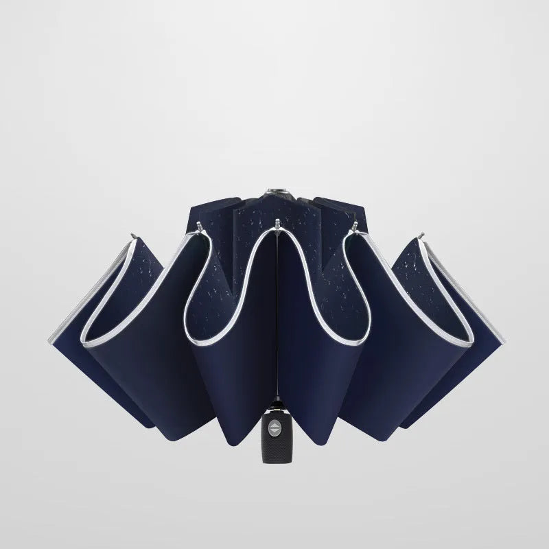Black automatic reverse umbrella with reflective canopy showing three-fold design and plastic non-slip handle