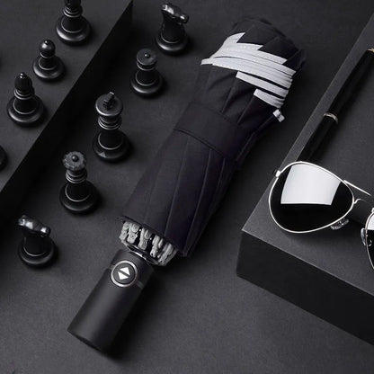 Black automatic reverse umbrella with reflective canopy showing three-fold design and plastic non-slip handle