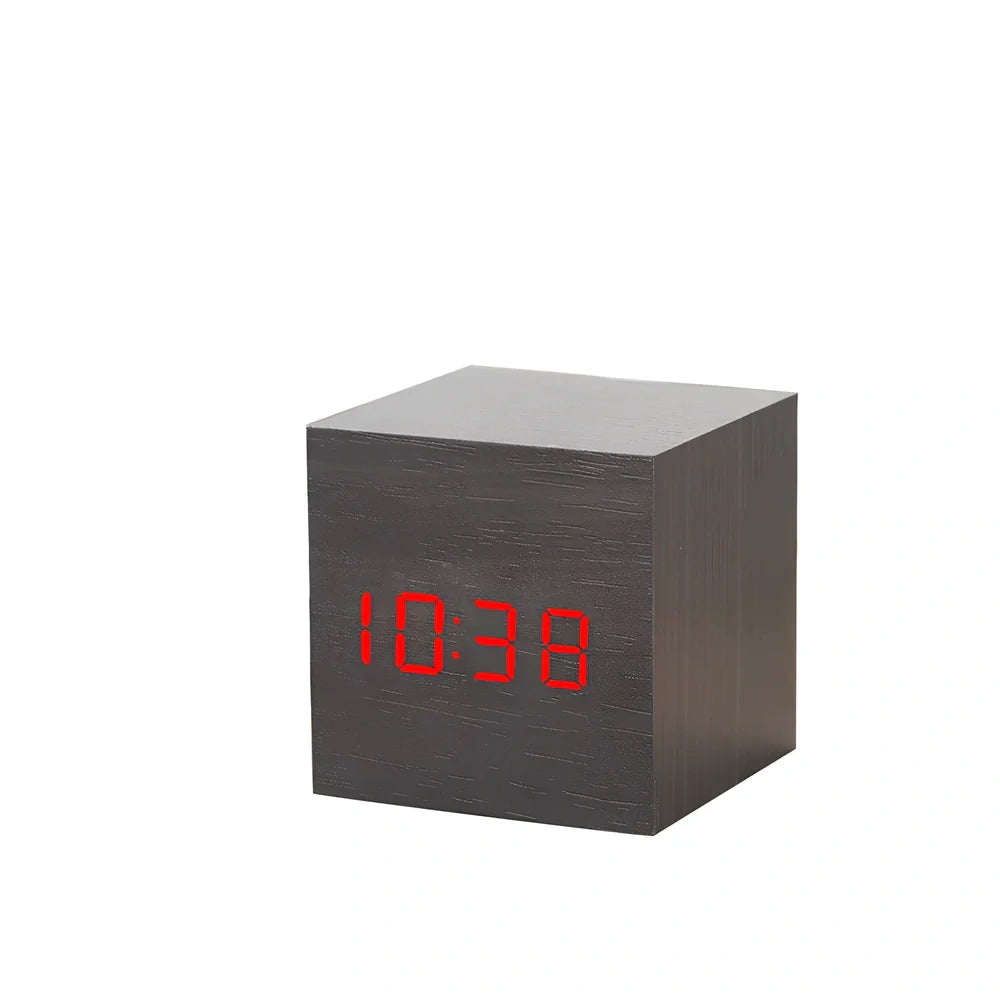 Wooden digital LED alarm clock on desktop with black finish showing time display