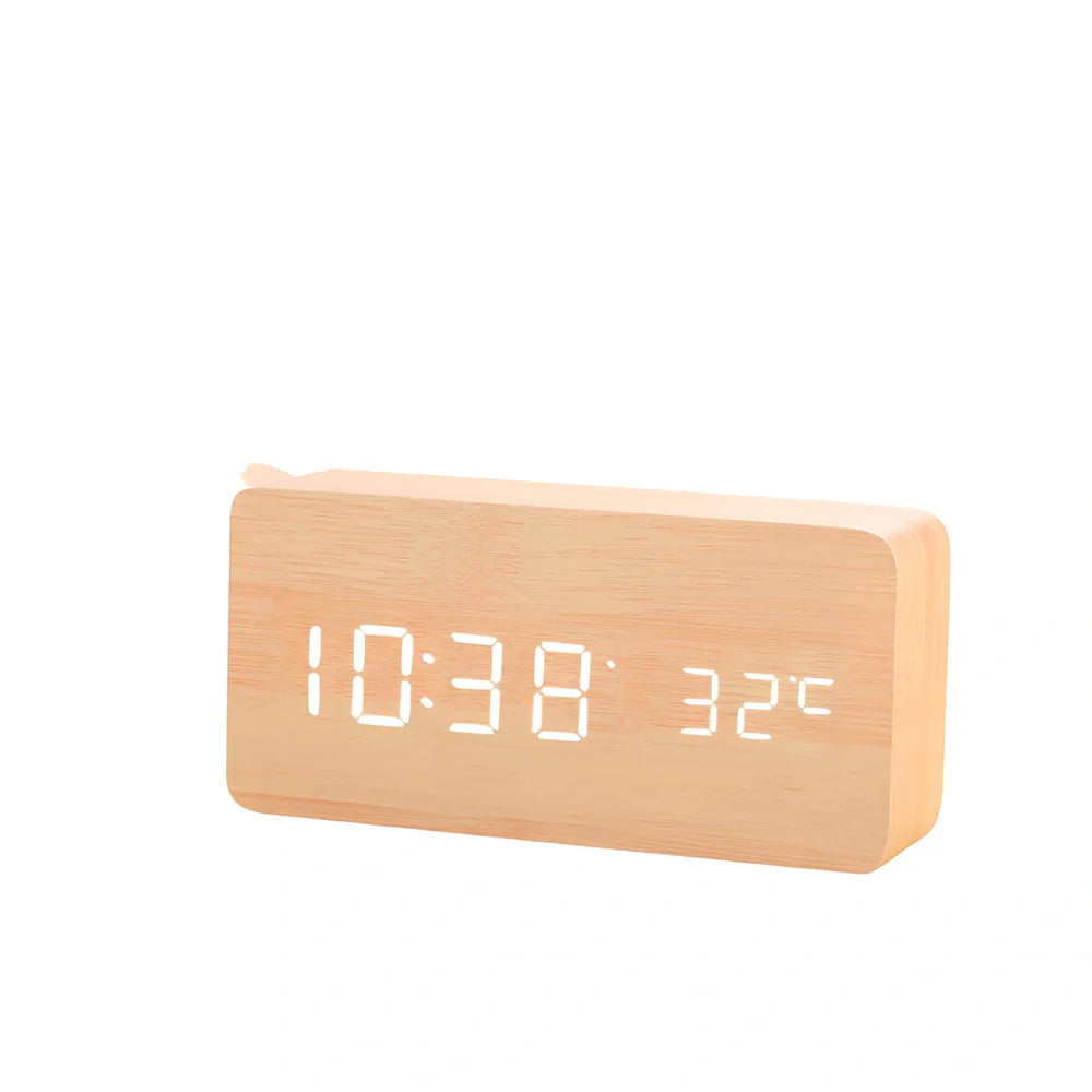 Wooden digital LED alarm clock on desktop with black finish showing time display