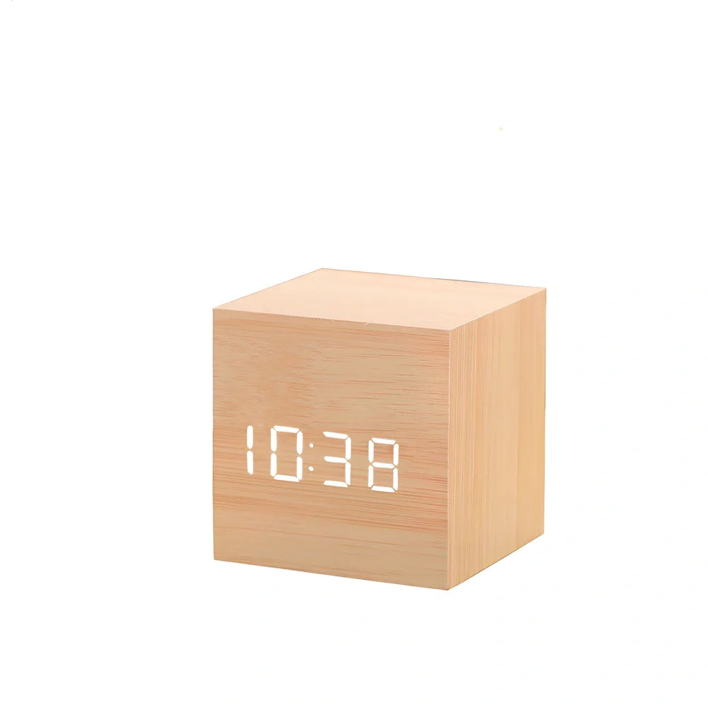 Wooden digital LED alarm clock on desktop with black finish showing time display