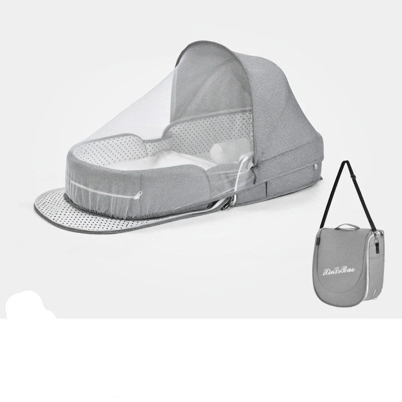Portable baby crib with sun protection and mosquito net, foldable design for easy travel