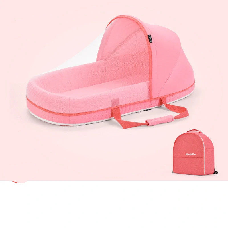 Portable baby crib with sun protection and mosquito net, foldable design for easy travel