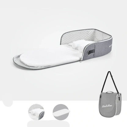 Portable baby crib with sun protection and mosquito net, foldable design for easy travel
