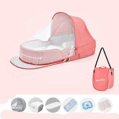 Portable baby crib with sun protection and mosquito net, foldable design for easy travel